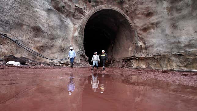 Engineers walk out of an under construction railway tunnel in Karka in the Reasi district in Jammu and Kashmir state March 4, 2015. India's government unveiled plans last month to invest $137 billion in its decrepit rail network over the next five years, heralding Prime Minister Narendra Modi's aggressive approach to building infrastructure needed to unlock faster economic growth. Picture taken March 4, 2015.