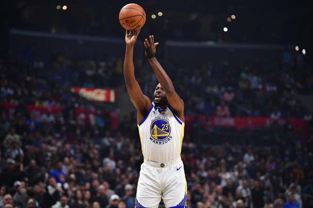 Mar 15, 2023; Los Angeles, California, USA; Golden State Warriors forward Draymond Green (23) shoots against the Los Angeles Clippers during the first half at Crypto.com Arena.