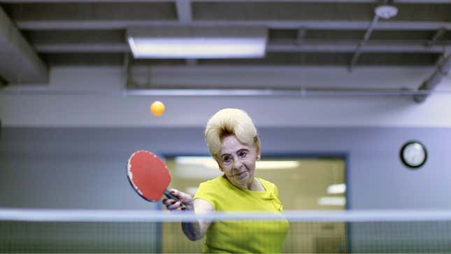 woman playing table tennis