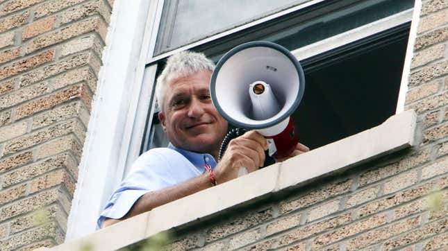 Donziger in the window of his Manhattan apartment in August 2021.