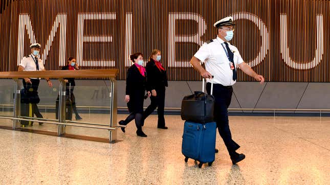 A Qantas flight crew arrive at Melbourne’s Tullamarine Airport on November 29, 2021.