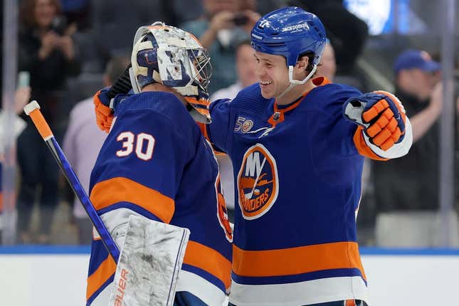 Apr 12, 2023; Elmont, New York, USA; New York Islanders left wing Matt Martin (17) hugs goaltender Ilya Sorokin (30) after defeating the Montreal Canadiens to clinch a spot in the playoffs at UBS Arena.