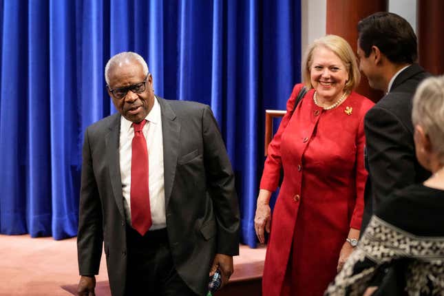 Associate Supreme Court Justice Clarence Thomas and his wife and conservative activist Virginia Thomas arrive at the Heritage Foundation on October 21, 2021, in Washington, DC. 