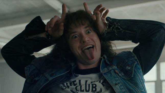 Eddie Munson makes devil horns and sticks out his tongue in a scene from Stranger Things.