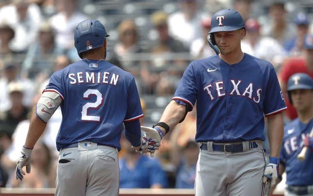 May 24, 2023; Pittsburgh, Pennsylvania, USA; Texas Rangers designated hitter Corey Seager (right) greets second baseman Marcus Semien (2) after hitting a solo home run against the Pittsburgh Pirates during the first inning at PNC Park.