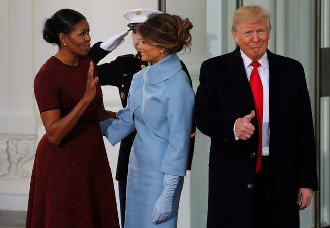 U.S. first lady Michelle Obama (L) greets U.S. President-elect Donald Trump (R) and his wife Melania for tea before the inauguration at the White House in Washington, U.S. January 20, 2017. REUTERS/Jonathan Ernst - RTSWH9R