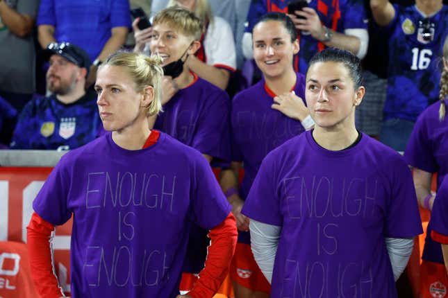 Sophie Schmidt and Sabrina D’Angelo of Canada look on as they wear purple shirts that read, “Enough is Enough” prior to the 2023 SheBelieves Cup match against the U.S.