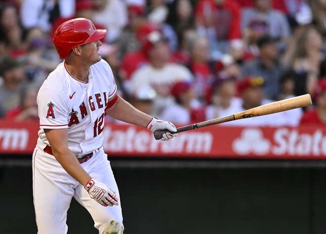 Apr 22, 2023; Anaheim, California, USA;  Los Angeles Angels right fielder Hunter Renfroe (12) hits a solo home run in the fourth inning against the Kansas City Royals at Angel Stadium.