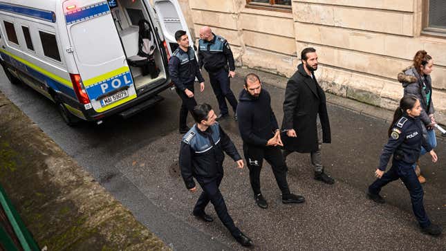 Andrew Tate (C-L) and his brother Tristan Tate (C-R) arrive at The Court of Appeal in Bucharest, Romania, on February 27, 2023. - British-American former kickboxer and controversial influencer Andrew Tate, 36 and his brother Tristan, 34, were arrested in late December 2022. The brothers and two Romanian women are under investigation for allegedly "forming an organised criminal group, human trafficking and rape". (Photo by Daniel MIHAILESCU / AFP) (Photo by DANIEL MIHAILESCU/AFP via Getty Images)
