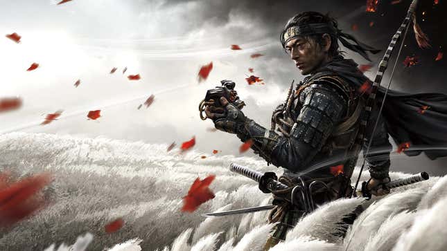 Jin from Ghost of Tsushima is seen standing in a field with red leaves passing by him in the wind. He's holding a broken mask and looking at it while deep in thought and holding his sword.