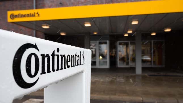 A Continental sign in front of an office building entrance.