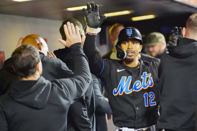 May 21, 2023;  New York City, New York, USA;  New York Mets shortstop Francisco Lindor (12) is congratulated by his teammates after he hit a home run in the sixth inning against the Cleveland Guardians at Citi Field.