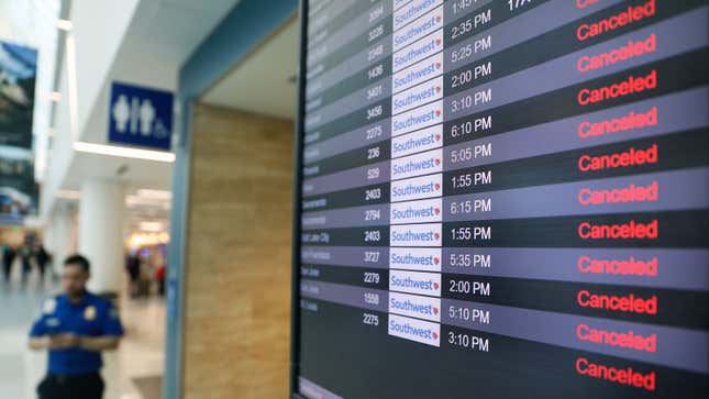 A departures board shows 12 canceled Southwest flights.
