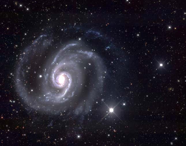 The Spanish Dancer is a pale blue spiral galaxy.