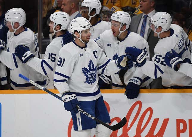 Mar 26, 2023; Nashville, Tennessee, USA; Toronto Maple Leafs center John Tavares (91) celebrates with teammates after a goal during the first period against the Nashville Predators at Bridgestone Arena.