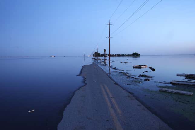 Floodwaters cover a road in Tulare Lake near Corcoran, CA on April 26, 2023. 