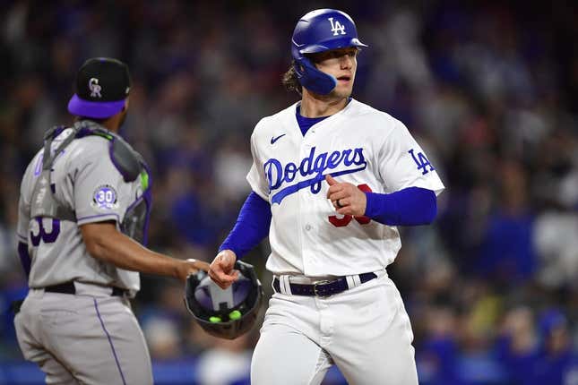 Apr 3, 2023; Los Angeles, California, USA; Los Angeles Dodgers left fielder James Outman (33) scores a run against the Colorado Rockies during the fifth inning at Dodger Stadium.