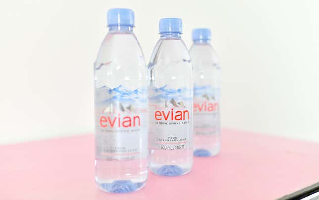 Three Evian water bottles.