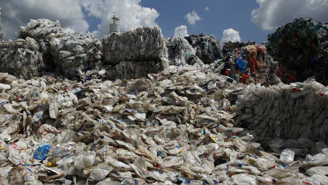 Discarded plastic bottles imported from Australia are seen at a plant in Hong Kong's rural New Territories August 24, 2011, before a process which separates plastic waste from them. The "Plastic Waste-to-Fuel System" is designed to provide a practical and cost effective solution to plastic waste management with energy regeneration. A prototype machine can process three tonnes of plastic waste into 1,000 litres of fuel oil per day. With further refinement, the fuel oil is suitable for diesel engine usage, said Ecotech Recycling Social Enterprise Managing Director Ming Cheung. Picture taken August 24, 2011. REUTERS/Bobby Yip
