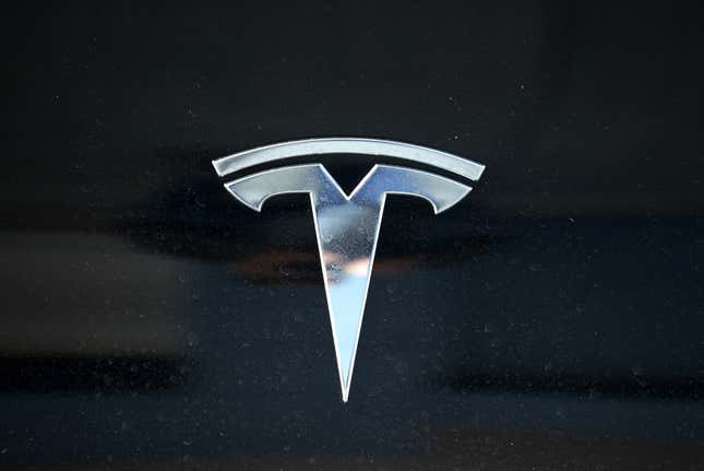 The Tesla logo is displayed on a Tesla car on April 26, 2021 in Corte Madera, California. Tesla will report first quarter earnings today after the closing bell. 