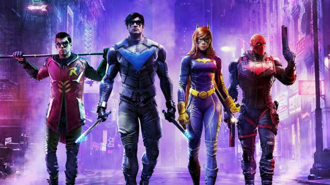 All four Bat Family members—Robin, Nightwing, Batgirl, and Red Hood—are walking toward the camera, a purple Gotham City glowing behind them.
