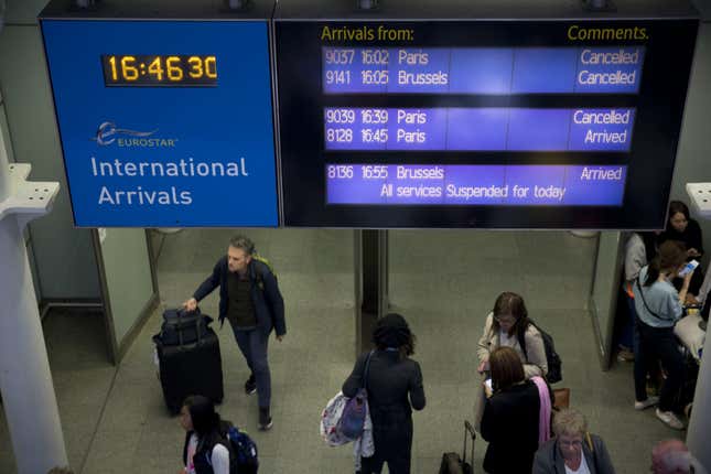 An information board shows Eurostar trains are canceled at St Pancras station in London, Tuesday, June 23, 2015.