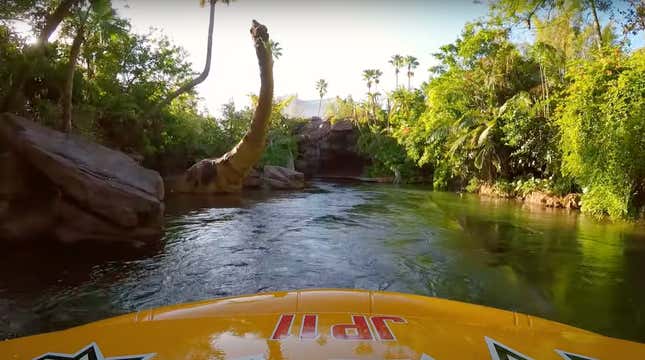 a boat pov of a dinosaur in the water
