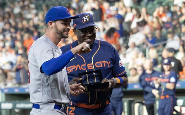 May 15, 2023; Houston, Texas, USA; Houston Astros manager Dusty Baker Jr. (12) hands Chicago Cubs first baseman Trey Mancini (36) his 2022 World Series ring before the game at Minute Maid Park.