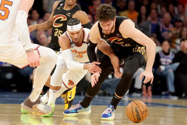 Apr 21, 2023; New York, New York, USA; New York Knicks guard Trevor Keels (3) and Cleveland Cavaliers forward Cedi Osman (16) fight for a loose ball during the second quarter of game three of the 2023 NBA playoffs at Madison Square Garden.