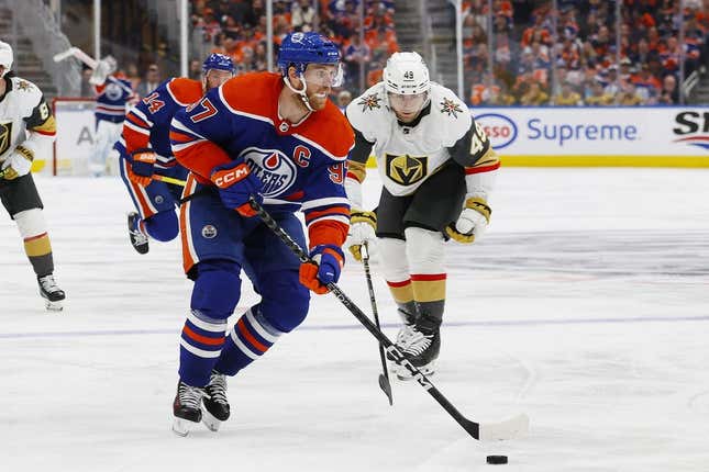 May 8, 2023; Edmonton, Alberta, CAN;Edmonton Oilers forward Connor McDavid (97) looks to make a pass in front of Vegas Golden Knights forward Ivan Barbashev (49) during the third period in game three of the second round of the 2023 Stanley Cup Playoffs at Rogers Place.