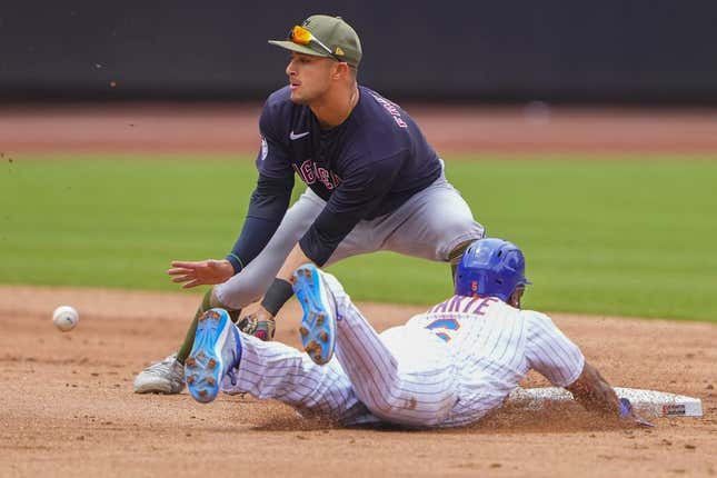 May 21, 2023; New York City, NY, USA; New York Mets right fielder Starling Marte (6) steals second base with Cleveland Guardians second baseman Tyler Freeman (2) receiving the throw during the second inning