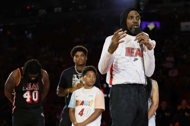 Apr 9, 2023; Miami, Florida, USA; Miami Heat forward Udonis Haslem (40) talks in front of his family during a ceremony to celebrate his last regular season game prior to the game against the Orlando Magic at Kaseya Center.