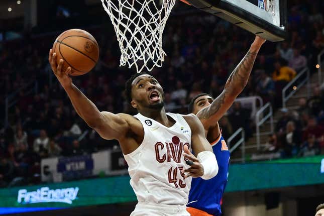 Mar 31, 2023; Cleveland, Ohio, USA; Cleveland Cavaliers guard Donovan Mitchell (45) drives to the basket against New York Knicks forward Obi Toppin (1) during the second half at Rocket Mortgage FieldHouse.