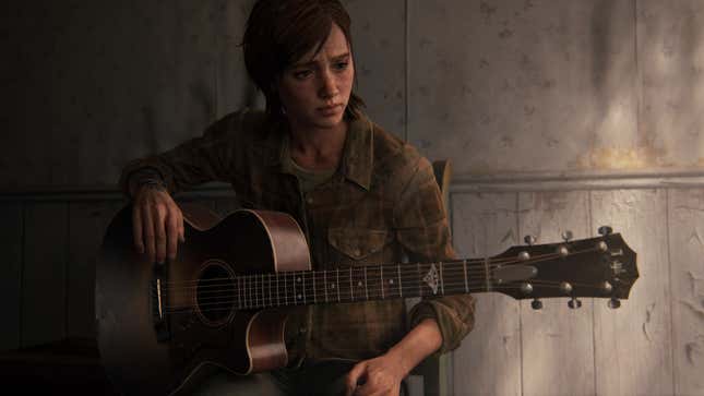 Ellie is seen sitting down with a guitar in her lap.