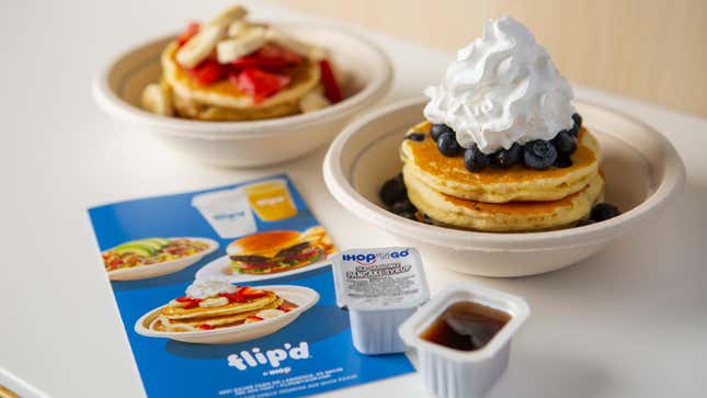 Flip'd by IHOP product shot of two pancake bowls dressed with fruit and whipped cream