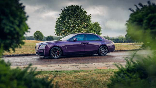 A photo of a purple Rolls Royce Phantom sedan. 
