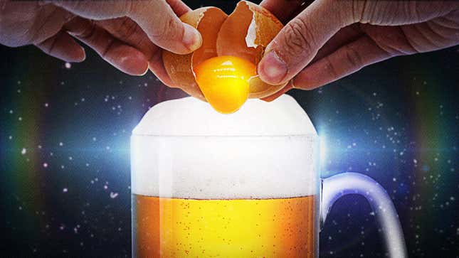 hands cracking egg into beer