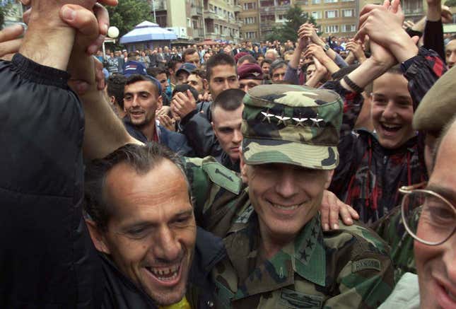NATO Supreme Commander Wesley Clark is welcomed in Kosovo in 1999; will he find a lucrative business deal there today?