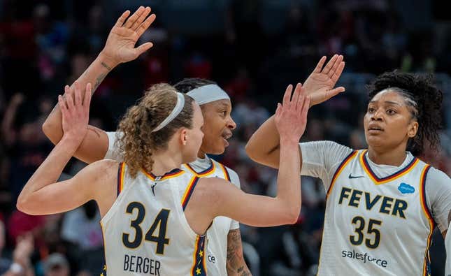 Grace Berger, Emma Cannon and Victoria Vivians celebrate after Berger made a basket during their game against the New York Liberty Wednesday, July 12, 2023 in Gainbridge Fieldhouse in Indianapolis.