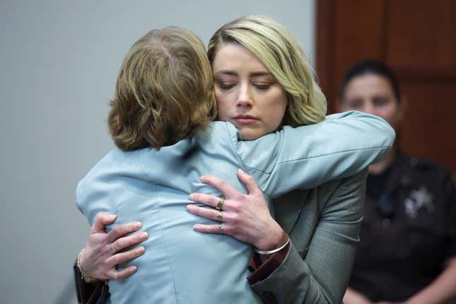 Actor Amber Heard hugs her attorney Elaine Bredehoft after she testified in the courtroom in the Fairfax County Circuit Courthouse in Fairfax, Va., Thursday, May 26, 2022.