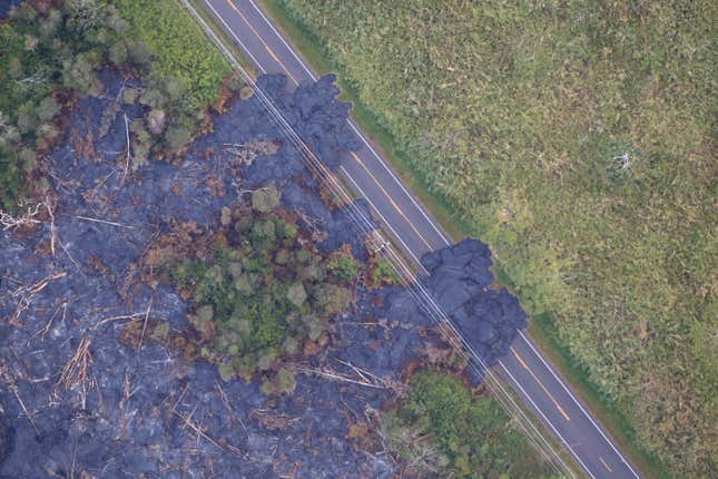 Image for article titled New aerial photos show Kilauea’s lava devouring neighborhoods