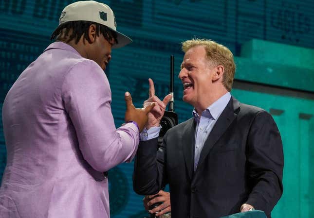 Apr 27, 2023; Kansas City, MO, USA; Georgia defensive lineman Jalen Carter reacts with NFL commissioner Roger Goodell after being selected by the Philadelphia Eagles ninth overall in the first round of the 2023 NFL Draft at Union Station.