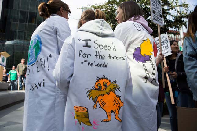 A student protestor wears a lab coat quoting the Lorax by Dr. Seuss during a climate protest in 2019.