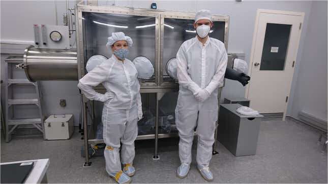 ESA scientists Francesca McDonald and Timon Schild standing next to their “Apollo can opener.”