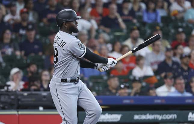Apr 2, 2023; Houston, Texas, USA; Chicago White Sox center fielder Luis Robert Jr. (88) hits a double during the first inning against the Houston Astros at Minute Maid Park.