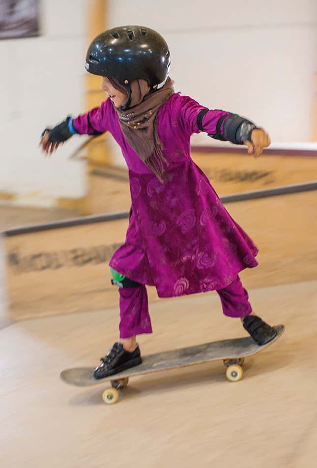 Image for article titled Photos: Forbidden from riding bikes, fearless Afghan girls are skateboarding around Kabul
