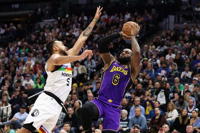 Mar 31, 2023; Minneapolis, Minnesota, USA; Los Angeles Lakers forward LeBron James (6) shoots while Minnesota Timberwolves forward Kyle Anderson (5) defends during the first quarter at Target Center.