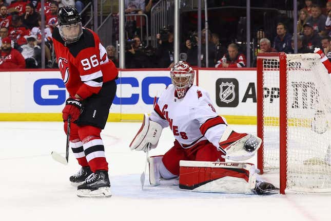 May 9, 2023; Newark, New Jersey, USA; Carolina Hurricanes goaltender Frederik Andersen (31) makes a save through a screen by New Jersey Devils right wing Timo Meier (96) during the second period in game four of the second round of the 2023 Stanley Cup Playoffs at Prudential Center.