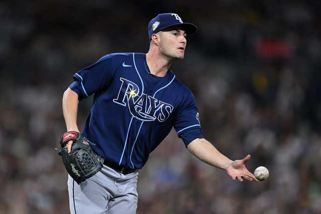 Jun 16, 2023; San Diego, California, USA; Tampa Bay Rays starting pitcher Shane McClanahan (18) tosses the ball to first base on a ground out by San Diego Padres left fielder Juan Soto (not pictured) during the sixth inning at Petco Park.
