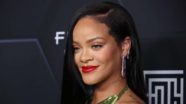Rihanna poses for a picture as she celebrates her beauty brands Fenty Beauty and Fenty Skin on February 11, 2022 in Los Angeles, California.